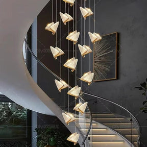 Manarola gold butterfly LED chandelier cascading above a stairwell
