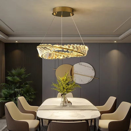Gold crystal ring chandelier illuminated in a living room