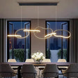 Levanto black adjustable interlocking ring pendant above a dining table