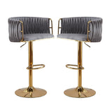 Pair of velvet swivel bar stools with gold round base styled at kitchen island — Allure Home Collections