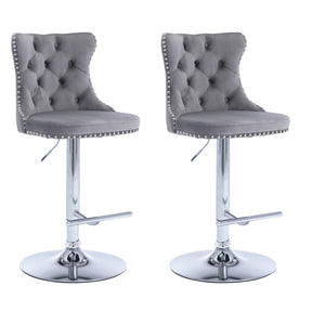 Patterson Lakes grey velvet tufted bar stools pair with nailhead trim