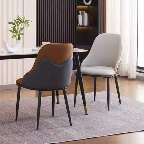 Nuriootpa orange faux leather dining armchair in a modern dining room