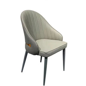Uraidla grey faux leather mid century dining chairs with metal legs in a modern dining room
