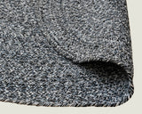 Detail of navy and white braided weave on recycled cotton round rug