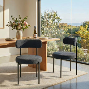Lobethal charcoal boucle dining chairs with matte black steel legs in a modern dining room