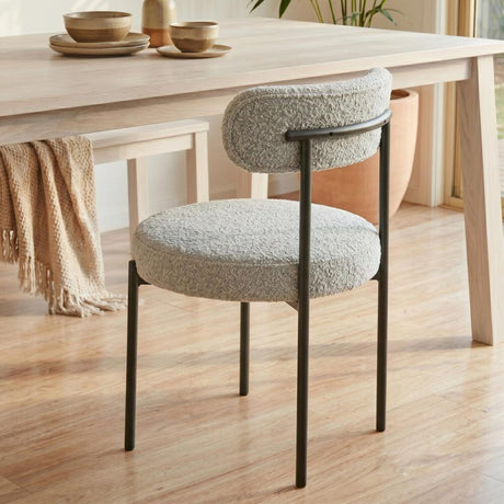 Angaston white boucle dining chair in a modern dining room