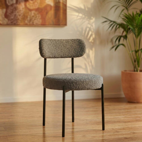 Angaston grey boucle dining chair in a modern dining room