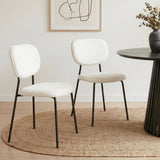 Bridgewater white teddy boucle armless dining chairs with steel legs in a dining room