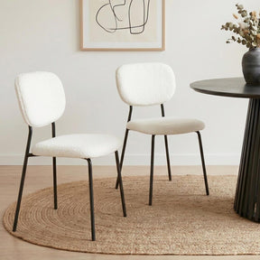 Bridgewater white teddy boucle armless dining chairs with steel legs in a dining room
