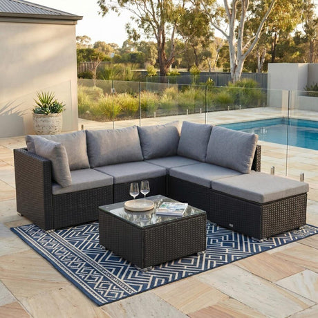 Caloundra black wicker outdoor lounge set on a sunny patio