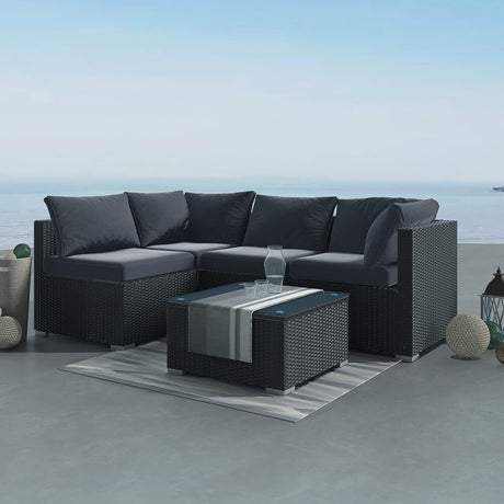 Caloundra black wicker outdoor lounge set on a sunny patio