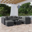 Nine piece black modular wicker outdoor lounge set with ottoman and glass table