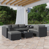 Nine piece black modular wicker outdoor lounge set with ottoman and glass table