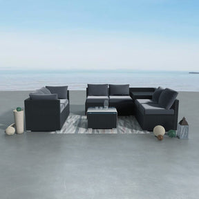 Eight piece black modular wicker outdoor lounge set with corner storage