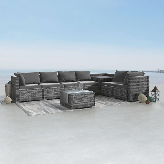 Eight piece grey modular wicker outdoor lounge set with corner storage