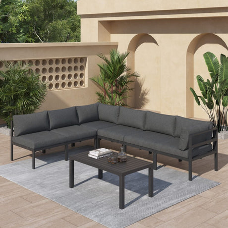 Wurtulla charcoal grey aluminium outdoor lounge set on a sunny patio
