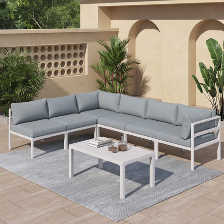 Wurtulla white aluminium outdoor lounge set on a sunny patio