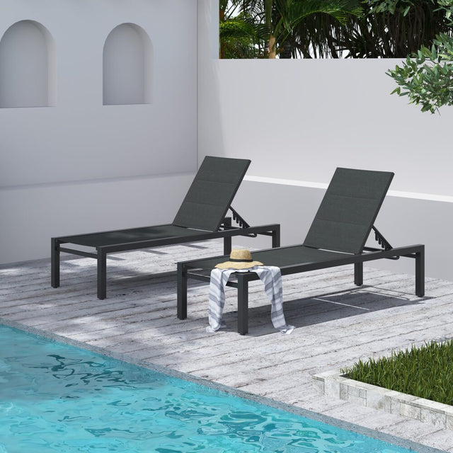 Minyama charcoal grey aluminium outdoor lounge set on a sunny patio