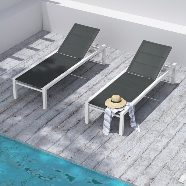Minyama white aluminium outdoor lounge set on a sunny patio