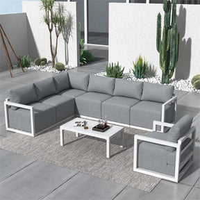 Seven seat white rattan outdoor garden lounge set with cushions and table
