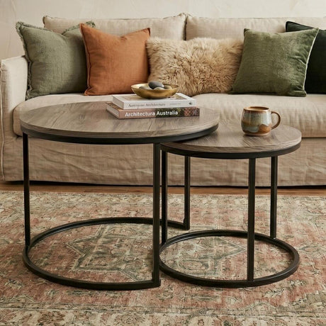 Homewood dark grey wood grain nesting coffee table in a modern living room