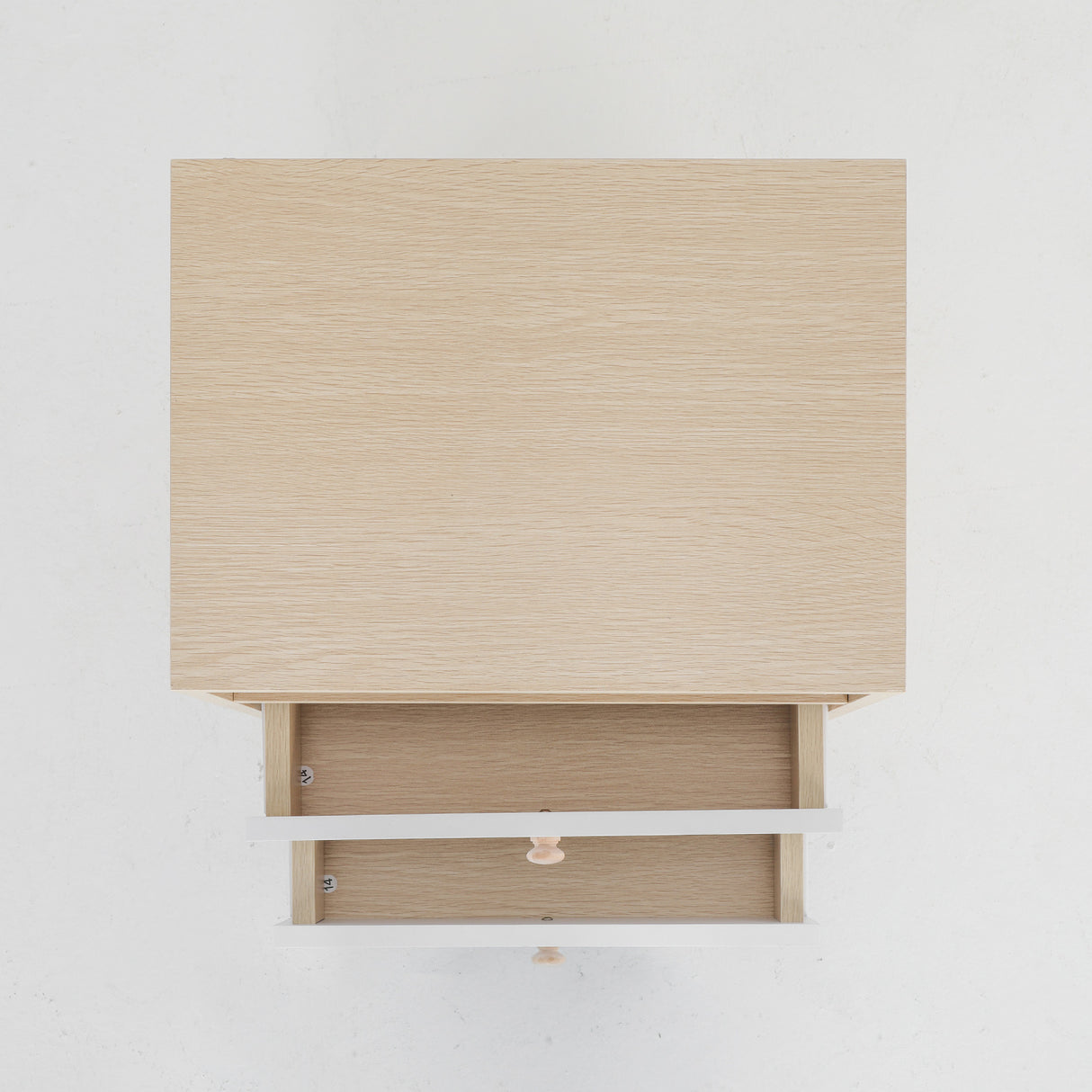 Suffolk Park oak two drawer bedside tables shown as a matching pair in a warm bedroom