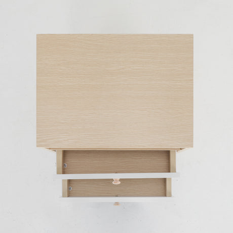 Suffolk Park oak two drawer bedside tables shown as a matching pair in a warm bedroom