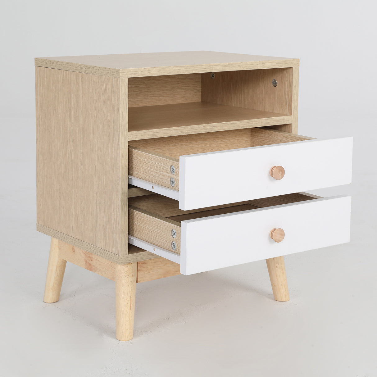 Suffolk Park oak two drawer bedside tables shown as a matching pair in a warm bedroom