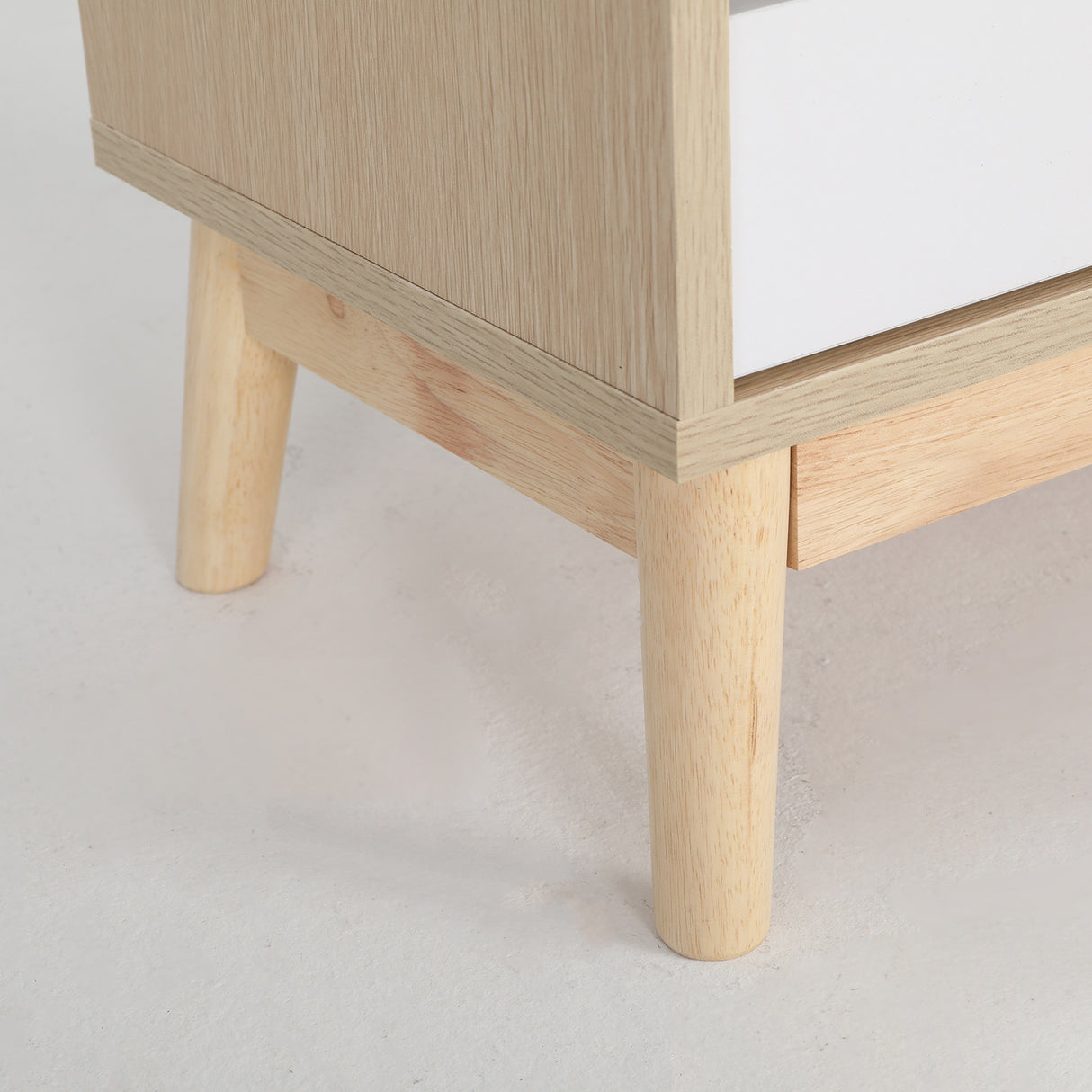 Suffolk Park oak two drawer bedside tables shown as a matching pair in a warm bedroom