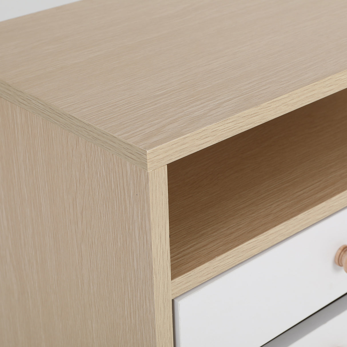 Suffolk Park oak two drawer bedside tables shown as a matching pair in a warm bedroom