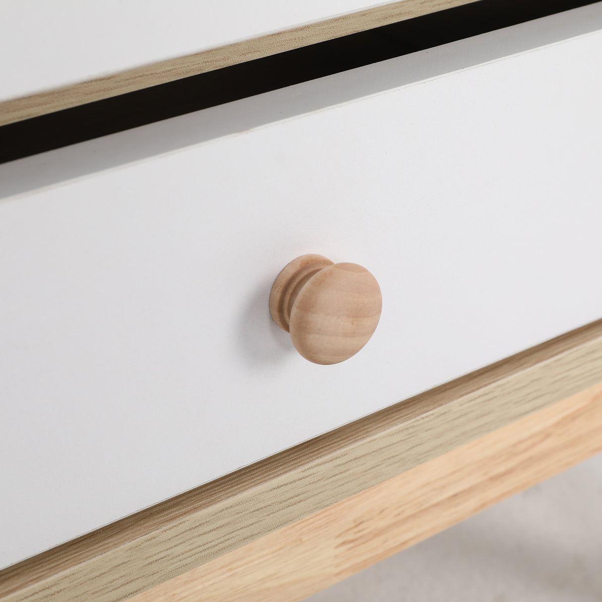 Suffolk Park oak two drawer bedside tables shown as a matching pair in a warm bedroom