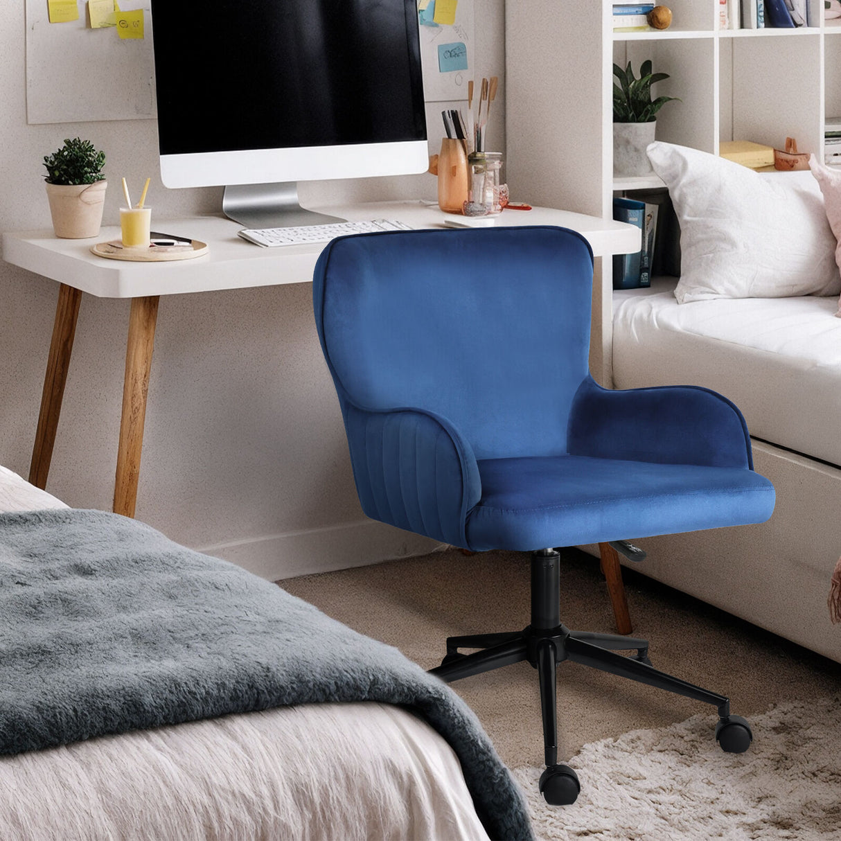 Balingup blue velvet swivel office chair at a home desk