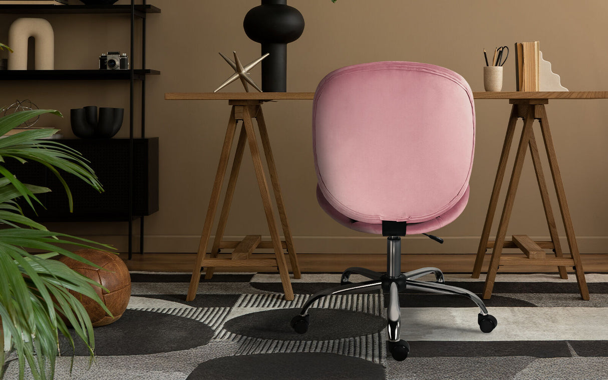 Scarborough pink velvet armless swivel office chair at a desk