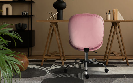 Scarborough pink velvet armless swivel office chair at a desk