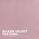 Scarborough pink velvet armless swivel office chair at a desk