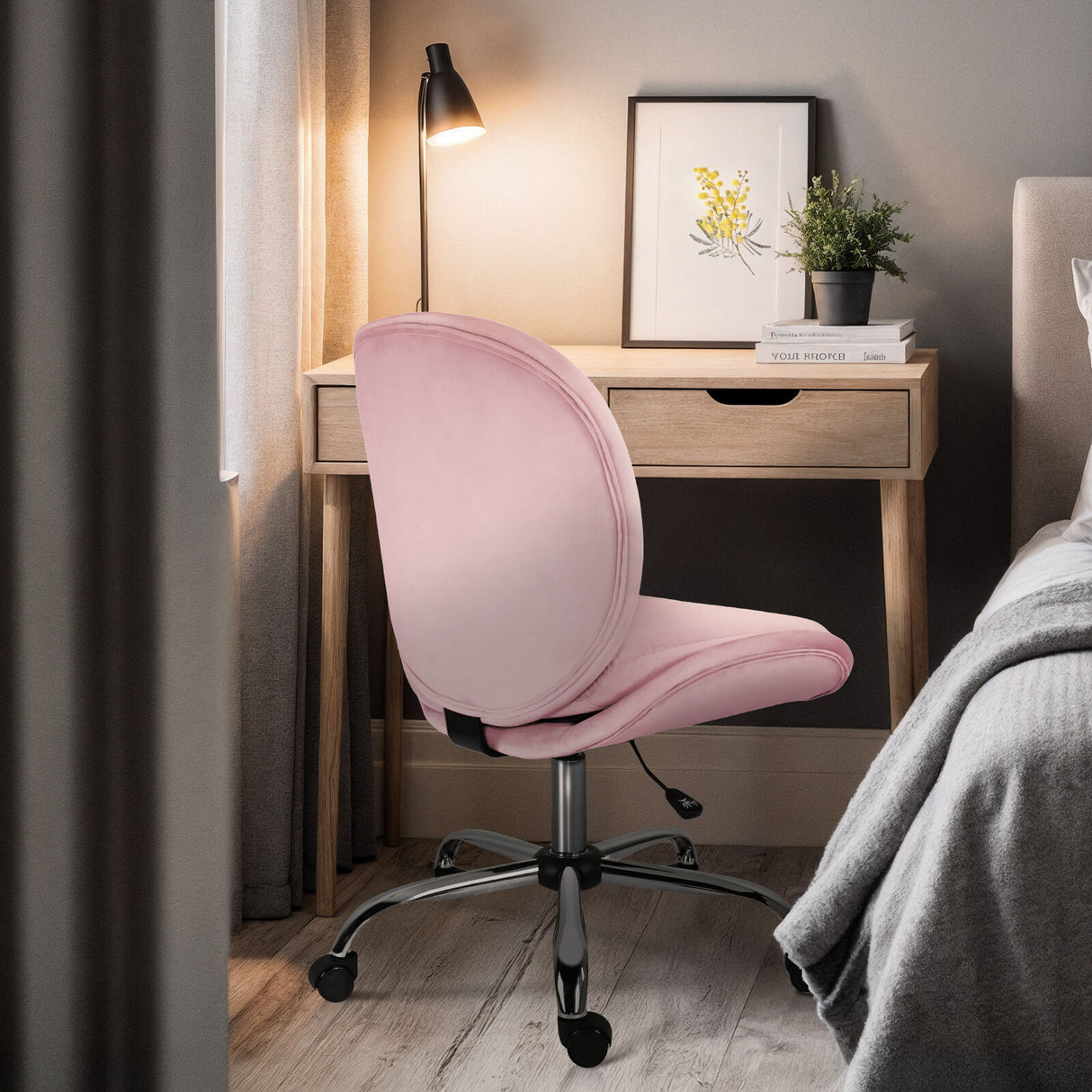 Scarborough pink velvet armless swivel office chair at a desk