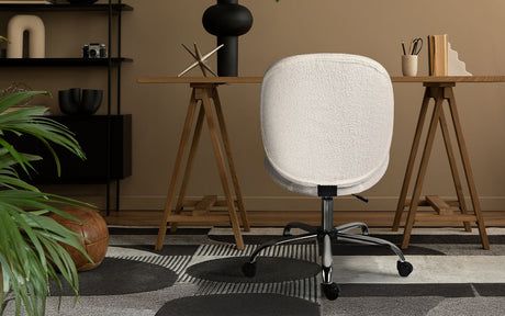 Scarborough white teddy boucle armless swivel office chair at a desk