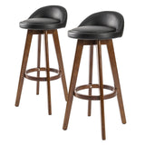 Sandhurst black and brown wooden bar stool with PVC leather swivel seat in a modern kitchen