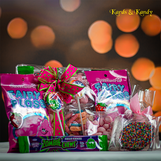 Langres chocolate and sweets gift hamper of chocolates and confectionery finished with a pink ribbon