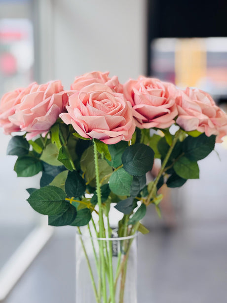 Soft pink artificial rose stem close-up showing lifelike petal and leaf detail — Allure Home Collections