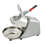 Stainless steel holding bowl catching fine shaved ice from the machine