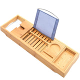 Bamboo bath caddy tray with extending sides resting across a bathtub