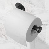 Toilet roll loaded onto the matte black adhesive paper holder