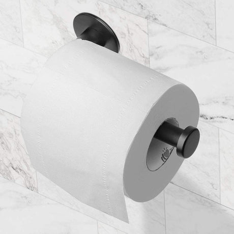 Toilet roll loaded onto the matte black adhesive paper holder