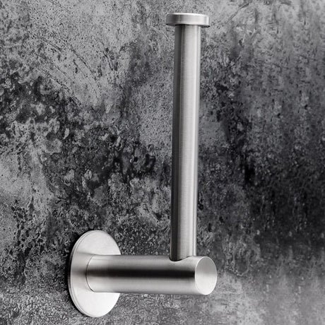 Toilet roll loaded onto the brushed silver adhesive paper holder