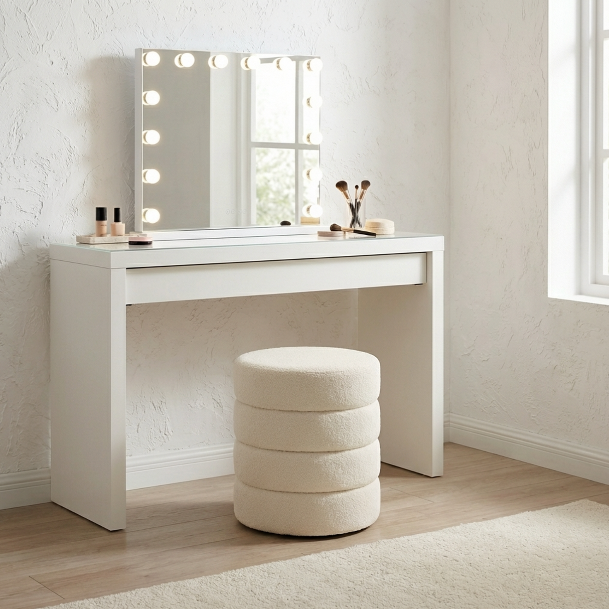 Barwon Heads white boucle ottoman footstool with a sculptural profile in a modern living room