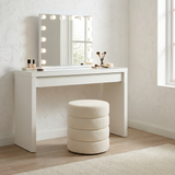 Barwon Heads white boucle ottoman footstool with a sculptural profile in a modern living room