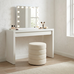 Barwon Heads white boucle ottoman footstool with a sculptural profile in a modern living room