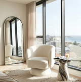 Bridalveil pearl white chenille swivel armchair in a modern living room