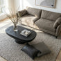 Whittlesea black stone resin coffee table in a modern living room